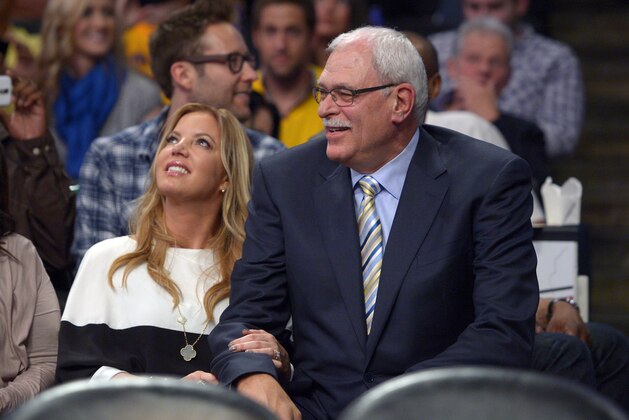 Jeanie Buss, left, Los Angeles Lakers executive vice president of business operations, and former Lakers head coach Phil Jackson sit during the first half of their NBA basketball game against the Dallas Mavericks, Tuesday, April 2, 2013, in Los Angeles. (AP Photo/Mark J. Terrill)