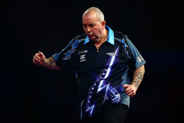 LONDON, ENGLAND - DECEMBER 30:  Phil Taylor of England looks dejected in his third round match against Jelle Klaasen of the Netherlands on Day Twelve of the 2016 William Hill PDC World Darts Championships at Alexandra Palace on December 30, 2015 in London, England.  (Photo by Jordan Mansfield/Getty Images)