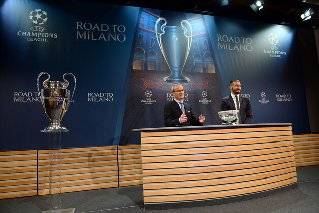 UEFA director of competitions Giorgio Marchetti (L) delivers a speech next to Italian former football player Gianluca Zambrotta ahead of the quarter-final draw for the UEFA Champions League, on March 18 at the UEFA headquarters in Nyon.  AFP PHOTO / JEAN-GUY PYTHON / AFP / JEAN-GUY PYTHON        (Photo credit should read JEAN-GUY PYTHON/AFP/Getty Images)