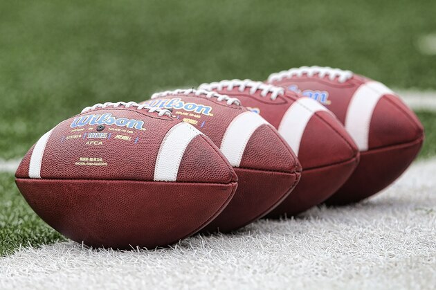 ANN ARBOR, MI - AUGUST 30: A detailed view of the Michigan footballs lined up on the sidelines, prior to the start of the game gainst the Appalachian State Mountaineers and the Michigan Wolverines on August 30, 2014 in Ann Arbor, Michigan. The Wolverines defeated the Mountaineers 52-14.  (Photo by Leon Halip/Getty Images)