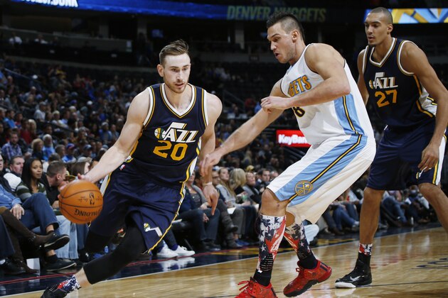 Utah Jazz forward Gordon Hayward, left, drives for a shot past Denver Nuggets forward Danilo Gallinari, center, as Jazz center Rudy Gobert watches during the second half of an NBA basketball game Thursday, Nov. 5, 2015, in Denver. Utah won 96-84. (AP Photo/David Zalubowski)