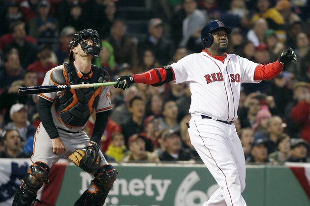 Boston Red Sox's David Ortiz, right, watches his two-run home run in front of Baltimore Orioles' Matt Wieters during the first inning of a baseball game in Boston, Tuesday, April 12, 2016. (AP Photo/Michael Dwyer)