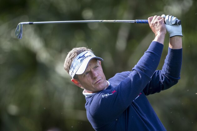Luke Donald, of England, watches his shot on the 10th tee during the first round of the RBC Heritage golf tournament in Hilton Head Island, S.C., Thursday, April 14, 2016. (AP Photo/Stephen B. Morton)