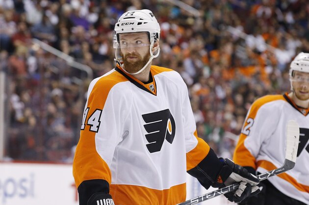 Philadelphia Flyers' Sean Couturier (14) and Michael Raffl (12), of Austria, pause on the ice during the second period of an NHL hockey game against the Arizona Coyotes Saturday, March 26, 2016, in Glendale, Ariz.  The Coyotes defeated the Flyers 2-1. (AP Photo/Ross D. Franklin)