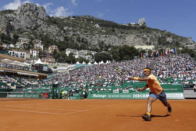 Spain's Rafael Nadal plays a return to Britain's Aljaz Bedene during their match of the Monte Carlo Tennis Masters tournament in Monaco, Wednesday, April 13, 2016. (AP Photo/Lionel Cironneau)