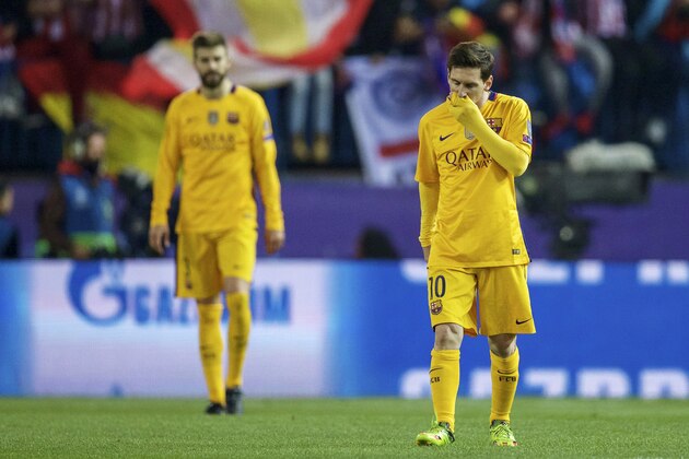 (L-R) Gerard Pique of FC Barcelona, Lionel Messi of FC Barcelona during the UEFA Champions League quarter-final match between  Atletico Madrid and FC Barcelona on April 13, 2016 at the Vicente Calderon stadium in Madrid, Spain.(Photo by VI Images via Getty Images)