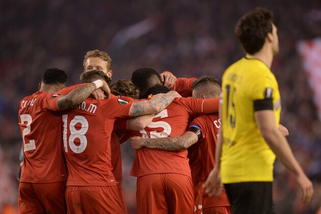 Liverpool players celebrate after winning the UEFA Europa league quarter-final second leg football match between Liverpool and Borussia Dortmund at Anfield stadium in Liverpool on April 14, 2016. / AFP / OLI SCARFF        (Photo credit should read OLI SCARFF/AFP/Getty Images)