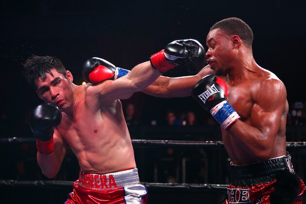 DALLAS, TX - NOVEMBER 28:  Welterweight fighters Errol Spence Jr. and Alejandro Barrera exchange punches during the Premier Boxing Champions at Bomb Factory on November 28, 2015 in Dallas, Texas.  (Photo by Sarah Crabill/Getty Images)