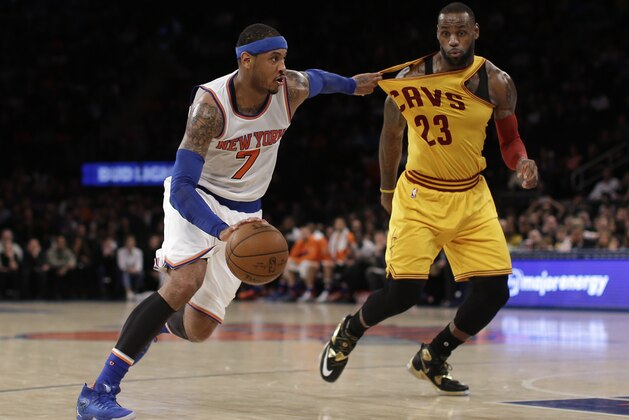 New York Knicks forward Carmelo Anthony (7) drives to the basket while snagging the jersey of Cleveland Cavaliers forward LeBron James during the fourth quarter of an NBA basketball game, Saturday, March 26, 2016, in New York. The Cavaliers won 107-93. (AP Photo/Julie Jacobson)
