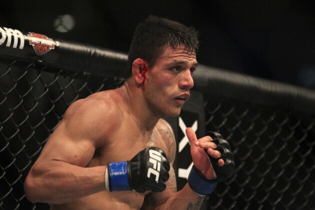 Rafael Dos Anjos fights Gleison Tibau during a UFC 139 Mixed Martial Arts lightweight bout in San Jose, Calif., Saturday, Nov. 19, 2011. (AP Photo/Jeff Chiu)