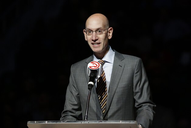 NBA Commissioner Adam Silver speaks at a halftime ceremony retiring the number of former Atlanta Hawks' Dikembe Mutombo at an NBA basketball game between the Hawks and the Boston Celtics Tuesday, Nov. 24, 2015, in Atlanta. (AP Photo/David Goldman)