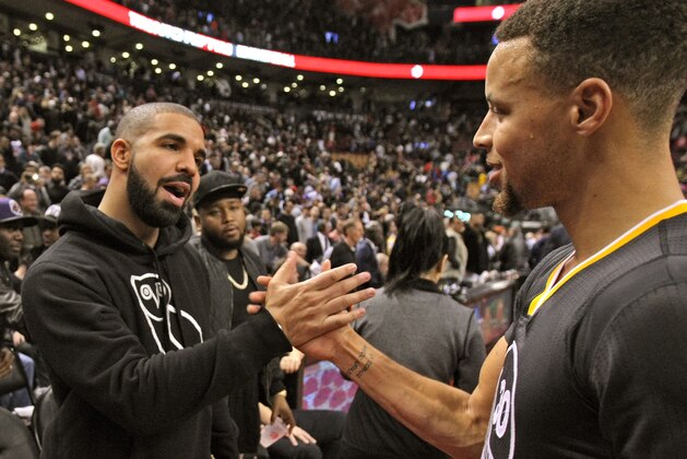 TORONTO, ON - DECEMBER 5:  Drake and Stephen Curry #30 of the Golden State Warriors after the game against the Toronto Raptors on December 5, 2015 at Air Canada Centre in Toronto, Ontario, Canada. NOTE TO USER: User expressly acknowledges and agrees that, by downloading and or using this photograph, User is consenting to the terms and conditions of the Getty Images License Agreement. Mandatory Copyright Notice: Copyright 2015 NBAE (Photo by Dave Sandford/NBAE via Getty Images)