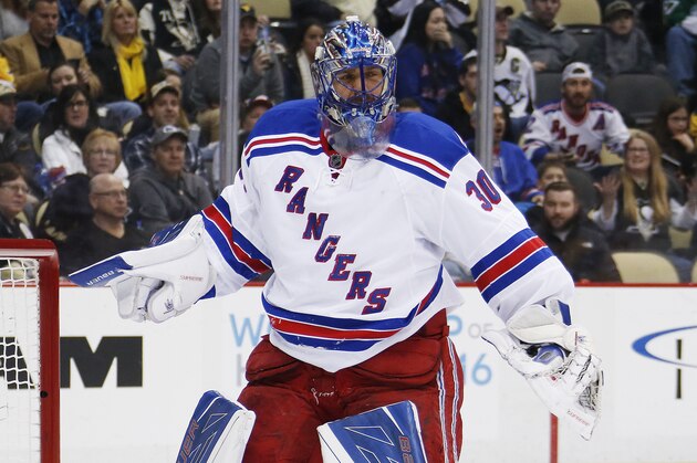 New York Rangers goalie Henrik Lundqvist (30) returns to the goal crease after colliding with teammate Ryan McDonagh (27) during the second period of NHL hockey game against the Pittsburgh Penguins in Pittsburgh, Thursday, March 3, 2016. (AP Photo/Gene J. Puskar)