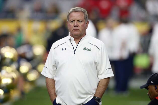 Notre Dame head coach Brian Kelly watches his players prior to the Fiesta Bowl NCAA College football game against Ohio State , Friday, Jan. 1, 2016, in Glendale, Ariz.  (AP Photo/Rick Scuteri)
