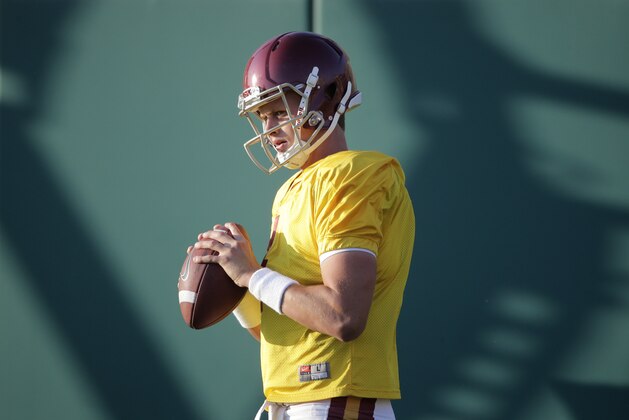 Southern California quarterback Max Browne holds the ball during NCAA college football practice Wednesday, Aug. 20, 2014, in Los Angeles. (AP Photo/Jae C. Hong)