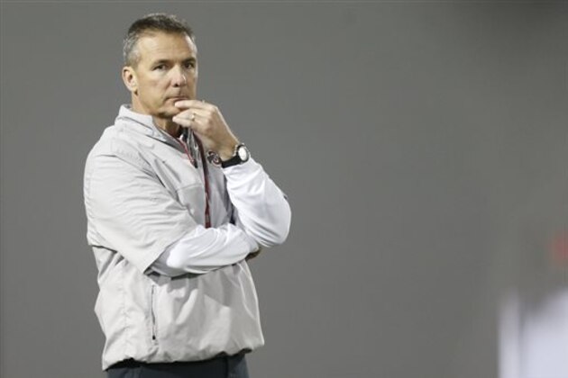 FILE - In this March 8, 2016, file photo, Ohio State coach Urban Meyer watches NCAA college football practice in Columbus, Ohio. Of all the holes he’s got to fill in Ohio State’s starting lineup this fall, Meyer recently has talked about the offensive and defensive lines as being the most critical areas of concern. (AP Photo/Jay LaPrete, File) FILE - In this March 8, 2016, file photo, Ohio State coach Urban Meyer watches NCAA college football practice in Columbus, Ohio. Of all the holes he’s got to fill in Ohio State’s starting lineup this fall, Meyer recently has talked about the offensive and defensive lines as being the most critical areas of concern. (AP Photo/Jay LaPrete, File)