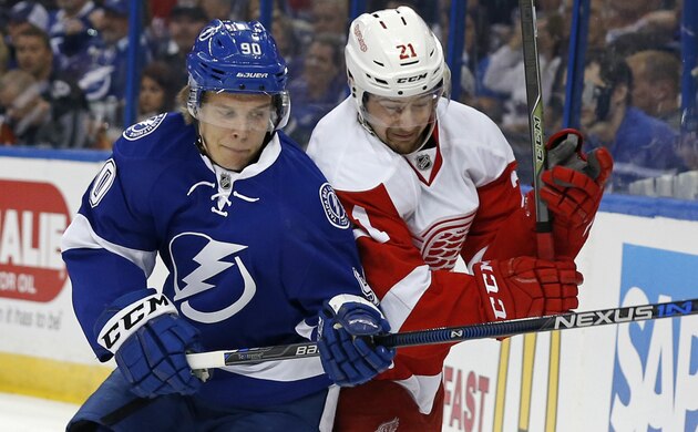 Apr 13, 2016; Tampa, FL, USA; Tampa Bay Lightning right wing Nikita Kucherov (86) is congratulated by center Tyler Johnson (9) and teammates after he scored against the Detroit Red Wings during the second period in game one of the first round of the 2016 Stanley Cup Playoffs at Amalie Arena. Mandatory Credit: Kim Klement-USA TODAY Sports