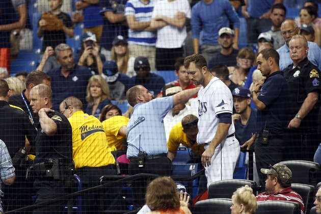 ST. PETERSBURG, FL - APRIL 15:  Steven Souza Jr. #20 of the Tampa Bay Rays comes into the stands to check on the status of a fan that was injured by a foul ball that was tipped by Souza while at bat during the seventh inning of a game against the Chicago White Sox on April 15, 2016 at Tropicana Field in St. Petersburg, Florida.  All players are wearing #42 in honor of Jackie Robinson Day. (Photo by Brian Blanco/Getty Images)