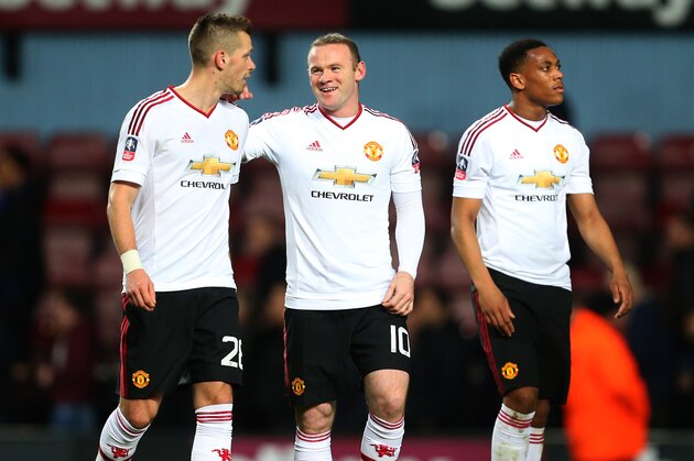LONDON, ENGLAND - APRIL 13: Wayne Rooney of Manchester United with Morgan Schneiderlin of Manchester United after the Emirates FA Cup Sixth Round Replay match between West Ham United and Manchester United at Boleyn Ground on April 13, 2016 in London, England. (Photo by Catherine Ivill - AMA/Getty Images)