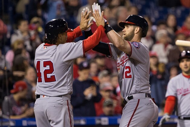 Apr 15, 2016; Philadelphia, PA, USA; Washington Nationals right fielder Bryce Harper (R) celebrates with third baseman Anthony Rendon (L) after hitting a two RBI home run during the sixth inning against the Philadelphia Phillies at Citizens Bank Park. Mandatory Credit: Bill Streicher-USA TODAY Sports