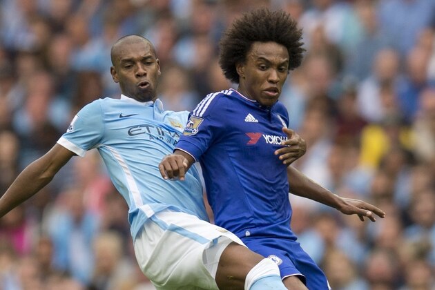 Chelsea's Brazilian midfielder Willian (R) vies for the ball with Manchester City's Brazilian midfielder Fernandinho during the English Premier League football match between Manchester City and Chelsea at The Etihad stadium in Manchester, north west England on August 16, 2015. AFP PHOTO / OLI SCARFF  RESTRICTED TO EDITORIAL USE. NO USE WITH UNAUTHORIZED AUDIO, VIDEO, DATA, FIXTURE LISTS, CLUB/LEAGUE LOGOS OR 'LIVE' SERVICES. ONLINE IN-MATCH USE LIMITED TO 75 IMAGES, NO VIDEO EMULATION. NO USE IN BETTING, GAMES OR SINGLE CLUB/LEAGUE/PLAYER PUBLICATIONS.        (Photo credit should read OLI SCARFF/AFP/Getty Images)
