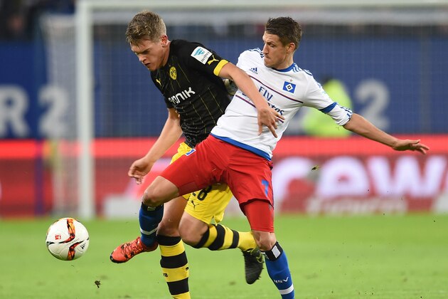Dortmund's defender Matthias Ginter (L) and Hamburg's Croatian midfielder Ivo Ilicevic vie for the ball during the German first division football Bundesliga match between Hamburg SV and Borussia Dortmund in Hamburg, northern Germany on November 20, 2015. AFP PHOTO / CARMEN JASPERSEN


RESTRICTIONS: DURING MATCH TIME: DFL RULES TO LIMIT THE ONLINE USAGE TO 15 PICTURES PER MATCH AND FORBID IMAGE SEQUENCES TO SIMULATE VIDEO. 
==RESTRICTED TO EDITORIAL USE ==
FOR FURTHER QUERIES PLEASE CONTACT THE DFL DIRECTLY AT + 49 69 650050.        (Photo credit should read CARMEN JASPERSEN/AFP/Getty Images)
