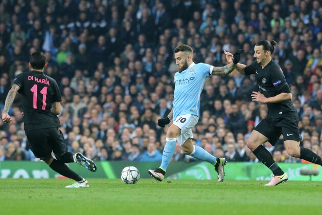 MANCHESTER, ENGLAND - APRIL 12:  Nicolas Otamendi of Manchester City FC in action with Zlatan Ibrahimovic of Paris Saint-Germain during the UEFA Champions League Quarter Final second leg match between Manchester City FC and Paris Saint-Germain at the Etihad Stadium on April 12, 2016 in Manchester, United Kingdom.  (Photo by Xavier Laine/Getty Images )