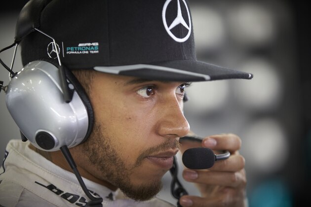 SHANGHAI, CHINA - APRIL 16:  Lewis Hamilton of Great Britain and Mercedes GP talks on the radio in the garage during qualifying for ahead of the Formula One Grand Prix of China at Shanghai International Circuit on April 16, 2016 in Shanghai, China.  (Photo by Steve Etherington/Getty Images)