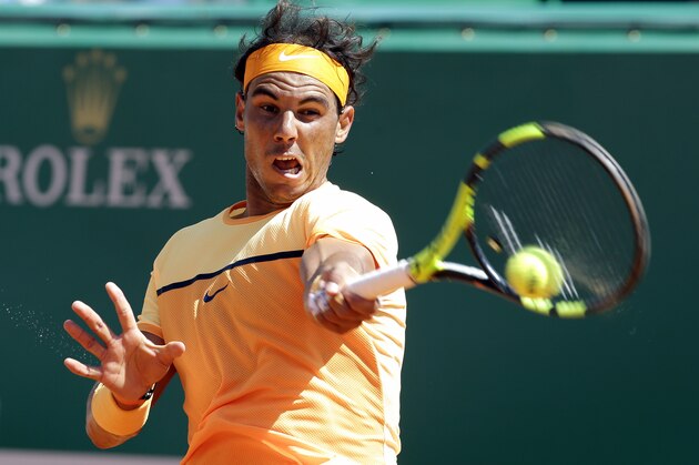 Spain's Rafael Nadal plays a return to Stanislas Wawrinka of Switzerland during their quarterfinal match of the Monte Carlo Tennis Masters tournament in Monaco, Friday, April 15, 2016. (AP Photo/Lionel Cironneau)