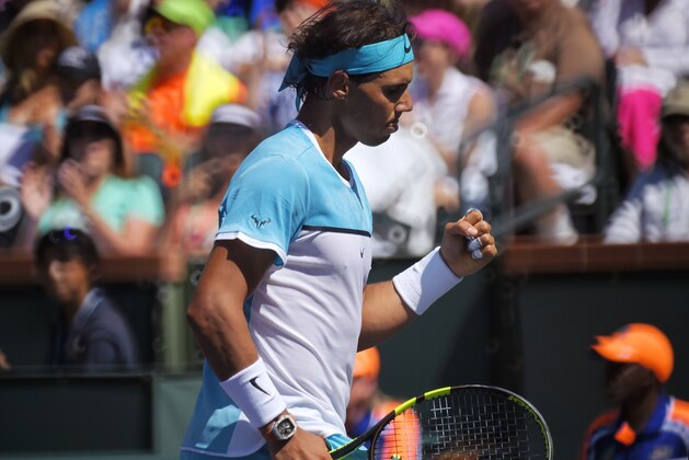 Rafael Nadal, of Spain, celebrates winning a point against Kei Nishikori, of Japan, at the BNP Paribas Open tennis tournament, Friday, March 18, 2016, in Indian Wells, Calif. Nadal won 6-4, 6-3. (AP Photo/Mark J. Terrill)
