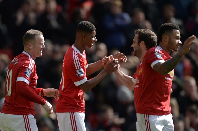 Manchester United's English striker Marcus Rashford (2R) shakes hands with Manchester United's Spanish midfielder Juan Mata (2R) after scoring the opening goal during the English Premier League football match between Manchester United and Aston Villa at Old Trafford in Manchester, north west England, on April 16, 2016. / AFP / OLI SCARFF / RESTRICTED TO EDITORIAL USE. No use with unauthorized audio, video, data, fixture lists, club/league logos or 'live' services. Online in-match use limited to 75 images, no video emulation. No use in betting, games or single club/league/player publications.  /         (Photo credit should read OLI SCARFF/AFP/Getty Images)