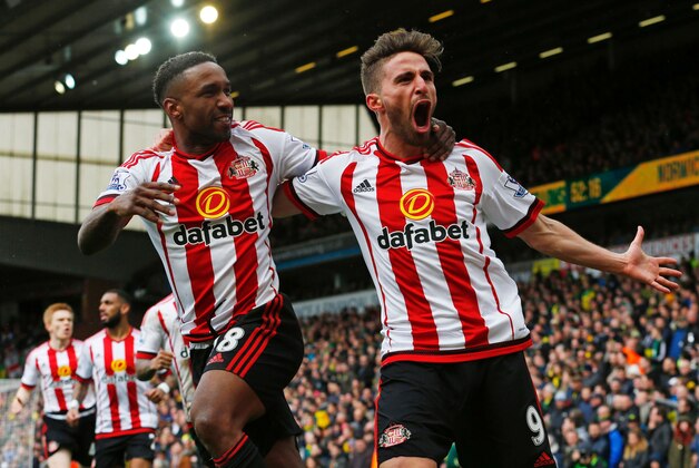 Sunderland's English striker Jermain Defoe (L) celebrates with Sunderland's Italian striker Fabio Borini (R) after scoring their second goal during the English Premier League football match between Norwich City and Sunderland at Carrow Road in Norwich, eastern England, on April 16, 2016.

 / AFP / LINDSEY PARNABY / RESTRICTED TO EDITORIAL USE. No use with unauthorized audio, video, data, fixture lists, club/league logos or 'live' services. Online in-match use limited to 75 images, no video emulation. No use in betting, games or single club/league/player publications.  /         (Photo credit should read LINDSEY PARNABY/AFP/Getty Images)