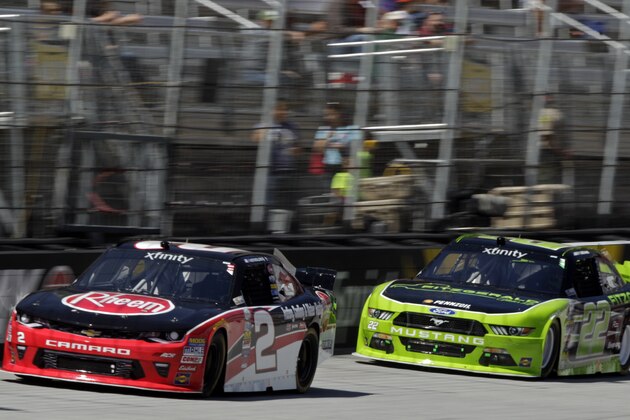 Austin Dillon (2) leads Joey Logano (22) during qualifying for a NASCAR Xfinity Series auto race on Saturday, April 16, 2016 in Bristol, Tenn. (AP Photo/Wade Payne)