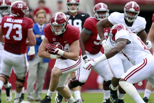 Apr 16, 2016; Tuscaloosa, AL, USA; Alabama Crimson Tide tight end Hale Hentges (84) carries the ball after catching a pass in the annual A-day game at Bryant-Denny Stadium. Mandatory Credit: Marvin Gentry-USA TODAY Sports