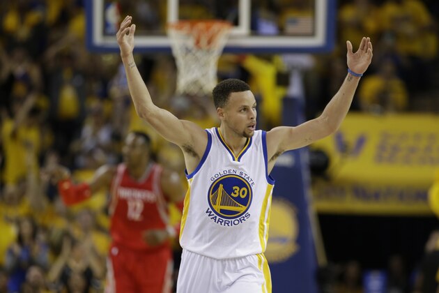Golden State Warriors' Stephen Curry (30) celebrates after scoring against the Houston Rockets during the first half in Game 1 of a first-round NBA basketball playoff series Saturday, April 16, 2016, in Oakland, Calif. (AP Photo/Marcio Jose Sanchez)