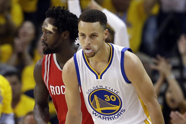 Golden State Warriors' Stephen Curry (30) celebrates after making a 3-point basket against the Houston Rockets during the first half in Game 1 of a first-round NBA basketball playoff series Saturday, April 16, 2016, in Oakland, Calif. (AP Photo/Marcio Jose Sanchez)