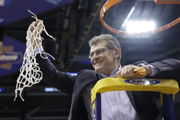 Connecticut head coach Geno Auriemmac celebrates by cutting down the net following the championship game against Syracuse at the women's Final Four in the NCAA college basketball tournament Tuesday, April 5, 2016, in Indianapolis. Connecticut won 82-51. (AP Photo/AJ Mast)