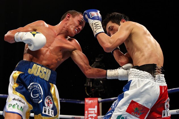 LEEDS, ENGLAND - APRIL 16:  Josh Warrington (L) in action against Hisashi Amagasa during their WBC International Featherweight title fight at First Direct Arena on April 16, 2016 in Leeds, England.  (Photo by Nigel Roddis/Getty Images)