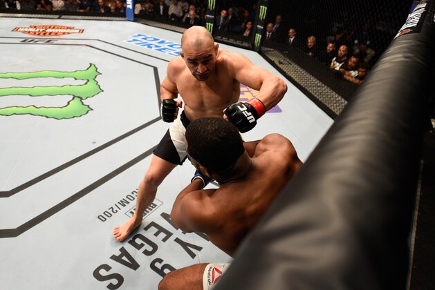 TAMPA, FL - APRIL 16:   (R-L) Glover Teixeira punches Rashad Evans in their light heavyweight bout during the UFC Fight Night event at Amalie Arena on April 16, 2016 in Tampa, Florida. (Photo by Jeff Bottari/Zuffa LLC/Zuffa LLC via Getty Images)