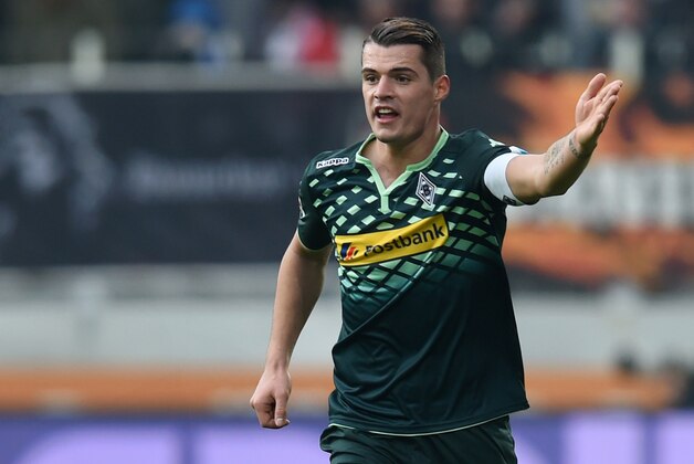 Moenchengladbach's Swiss midfielder Granit Xhaka plays the ball during the German first division Bundesliga football match of FC Augsburg vs Borussia Moenchengladbach in Augsburg, southern Germany, on February 28, 2016.

RESTRICTIONS: DURING MATCH TIME: DFL RULES TO LIMIT THE ONLINE USAGE TO 15 PICTURES PER MATCH AND FORBID IMAGE SEQUENCES TO SIMULATE VIDEO. == RESTRICTED TO EDITORIAL USE == FOR FURTHER QUERIES PLEASE CONTACT DFL DIRECTLY AT + 49 69 650050 / AFP / CHRISTOF STACHE / RESTRICTIONS: DURING MATCH TIME: DFL RULES TO LIMIT THE ONLINE USAGE TO 15 PICTURES PER MATCH AND FORBID IMAGE SEQUENCES TO SIMULATE VIDEO. == RESTRICTED TO EDITORIAL USE == FOR FURTHER QUERIES PLEASE CONTACT DFL DIRECTLY AT + 49 69 650050
        (Photo credit should read CHRISTOF STACHE/AFP/Getty Images)