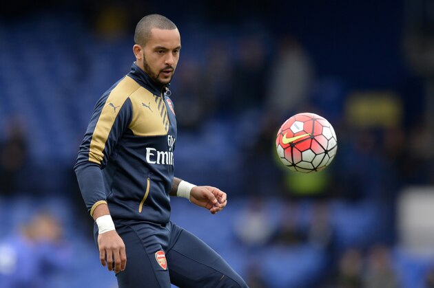 Arsenal's English midfielder Theo Walcott warms up ahead of the English Premier League football match between Everton and Arsenal at Goodison Park in Liverpool, north west England on March 19, 2016. / AFP / OLI SCARFF / RESTRICTED TO EDITORIAL USE. No use with unauthorized audio, video, data, fixture lists, club/league logos or 'live' services. Online in-match use limited to 75 images, no video emulation. No use in betting, games or single club/league/player publications.  /         (Photo credit should read OLI SCARFF/AFP/Getty Images)