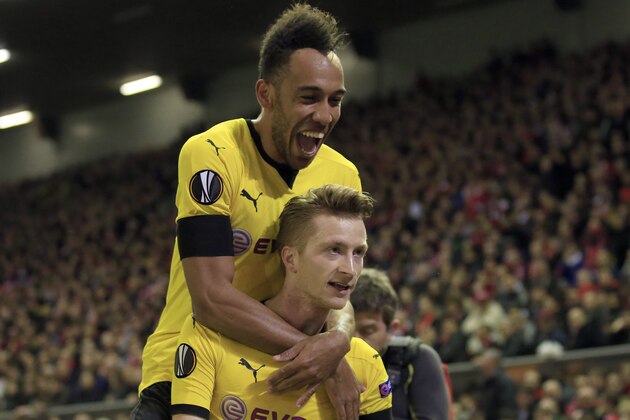 Dortmund's Pierre-Emerick Aubameyang, top, and Dortmund's Marco Reus celebrate after scoring during the Europa League quarterfinal second leg soccer match between Liverpool FC and Borussia Dortmund in Liverpool, England, Thursday, April 14, 2016 . (AP Photo/Jon Super) Dortmund's Pierre-Emerick Aubameyang, top, and Dortmund's Marco Reus celebrate after scoring during the Europa League quarterfinal second leg soccer match between Liverpool FC and Borussia Dortmund in Liverpool, England, Thursday, April 14, 2016 . (AP Photo/Jon Super)