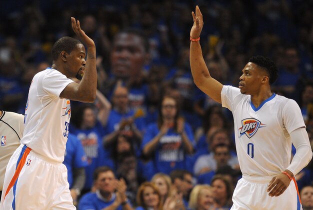Apr 16, 2016; Oklahoma City, OK, USA; Oklahoma City Thunder forward Kevin Durant (35) and  guard Russell Westbrook (0) react after a play against the Dallas Mavericks during the second quarter in game one of their first round NBA Playoff series at Chesapeake Energy Arena. Mandatory Credit: Mark D. Smith-USA TODAY Sports