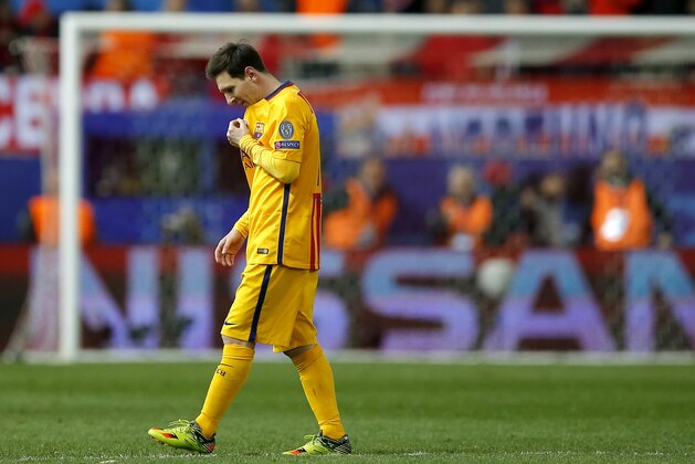 Barcelona's Lionel Messi walks on the pitch during the Champions League 2nd leg quarterfinal soccer match between Atletico Madrid and Barcelona at the Vicente Calderon stadium in Madrid, Spain, Wednesday April 13, 2016. Atletico defeated Barcelona by 2-0. (AP Photo/Paul White)