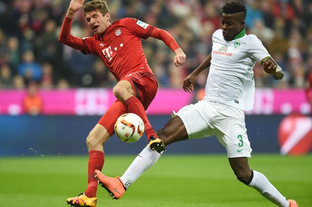 Bayern Munich's striker Thomas Mueller (L) and Bremen' Senegalese defender Papy Djiobodji vie for the ball during the German first division Bundesliga football match FC Bayern Munich v Werder Bremen in Munich, southern Germany on March 12, 2016. / AFP / CHRISTOF STACHE / RESTRICTIONS: DURING MATCH TIME: DFL RULES TO LIMIT THE ONLINE USAGE TO 15 PICTURES PER MATCH AND FORBID IMAGE SEQUENCES TO SIMULATE VIDEO. == RESTRICTED TO EDITORIAL USE == FOR FURTHER QUERIES PLEASE CONTACT DFL DIRECTLY AT + 49 69 650050
        (Photo credit should read CHRISTOF STACHE/AFP/Getty Images)