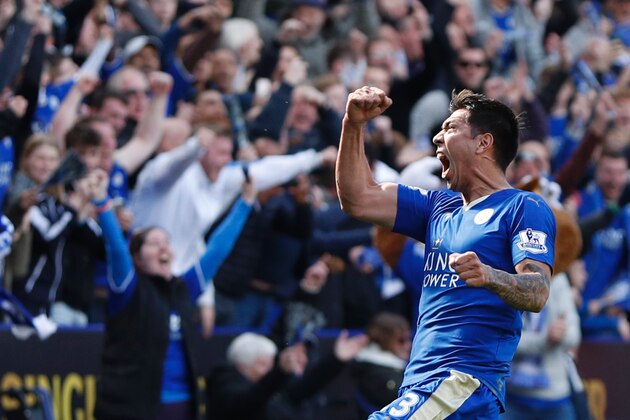 Leicester City's Argentinian striker Leonardo Ulloa celebrates after scoring their second goal from the penalty spot to equalise 2-2 as West Ham United's Spanish goalkeeper Adrian (R) reacts during the English Premier League football match between Leicester City and West Ham United at King Power Stadium in Leicester, central England on April 17, 2016. / AFP / ADRIAN DENNIS / RESTRICTED TO EDITORIAL USE. No use with unauthorized audio, video, data, fixture lists, club/league logos or 'live' services. Online in-match use limited to 75 images, no video emulation. No use in betting, games or single club/league/player publications.  /         (Photo credit should read ADRIAN DENNIS/AFP/Getty Images)