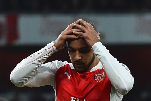 Arsenal's English midfielder Theo Walcott reacts after missing a chance during the English Premier League football match between Arsenal and Chelsea at the Emirates Stadium in London on January 24, 2016. AFP PHOTO / BEN STANSALL

 / AFP / BEN STANSALL        (Photo credit should read BEN STANSALL/AFP/Getty Images)
