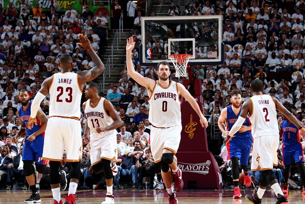 CLEVELAND, OH  - APRIL 17: Kevin Love #0 high fives teammate LeBron James #23 of the Cleveland Cavaliers during the Round One of the 2015 NBA Playoffs against the Detroit Pistons on April 17, 2016 at Quicken Loans Arena in Cleveland, Ohio. NOTE TO USER: User expressly acknowledges and agrees that, by downloading and or using this Photograph, user is consenting to the terms and conditions of the Getty Images License Agreement. Mandatory Copyright Notice: Copyright 2016 NBAE (Photo by Nathaniel S. Bulter/NBAE via Getty Images
