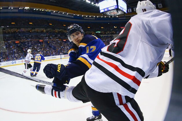 ST. LOUIS, MO - APRIL 15: Jaden Schwartz #17 of the St. Louis Blues checks Jonathan Toews #19 of the Chicago Blackhawks into the boards in Game Two of the Western Conference Quarterfinals during the 2016 NHL Stanley Cup Playoffs at the Scottrade Center on April 15, 2016 in St. Louis, Missouri.  The Blackhawks beat the Blues 3-2.  (Photo by Dilip Vishwanat/ Getty Images)