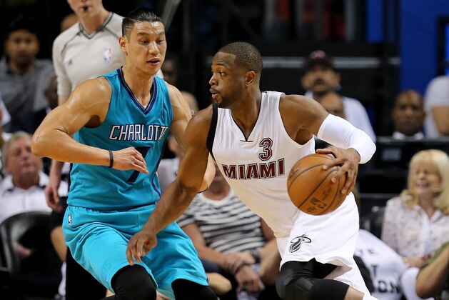MIAMI, FL - APRIL 17:  Dwyane Wade #3 of the Miami Heat drives on Jeremy Lin #7 of the Charlotte Hornets  during Game One of the Eastern Conference Quarterfinals  during the 2016 NBA Playoffs  at American Airlines Arena on April 17, 2016 in Miami, Florida. NOTE TO USER: User expressly acknowledges and agrees that, by downloading and or using this photograph, User is consenting to the terms and conditions of the Getty Images License Agreement.  (Photo by Mike Ehrmann/Getty Images)